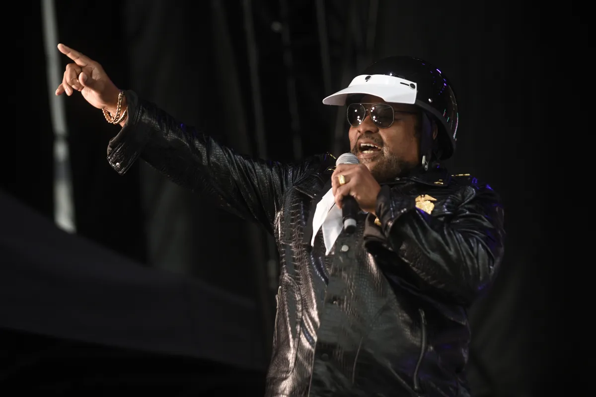 Victor Willis performing with the Village People, dressed as a police officer in his iconic costume.