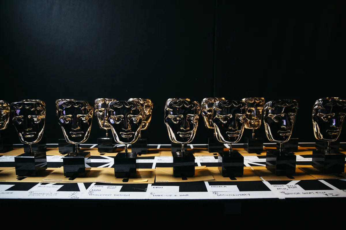 A golden BAFTA award statuette.