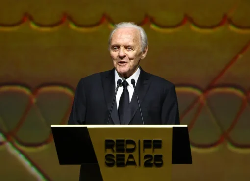 A dignified portrait of actor Anthony Hopkins looking thoughtful.