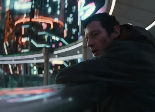 Callum Turner appearing on screen at Comic-Con.