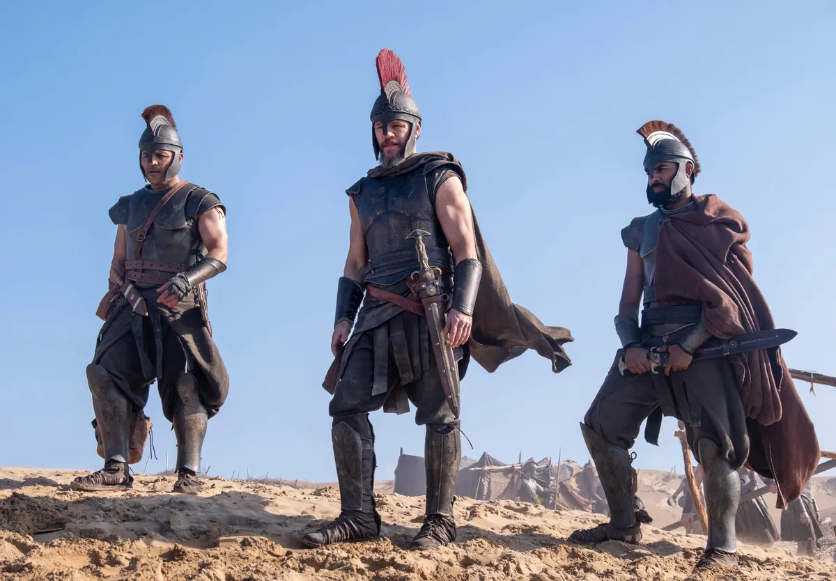 A dramatic movie poster for 'The Odyssey' showing an epic, visually stunning scene of adventure.