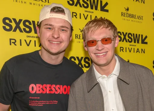 Photo of actors Cooper Tomlinson and Curry Barker on a movie set.