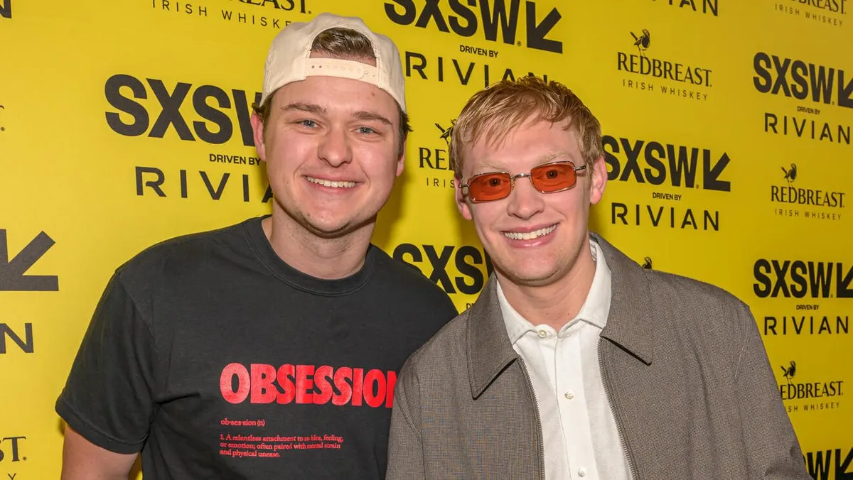 Photo of actors Cooper Tomlinson and Curry Barker on a movie set.