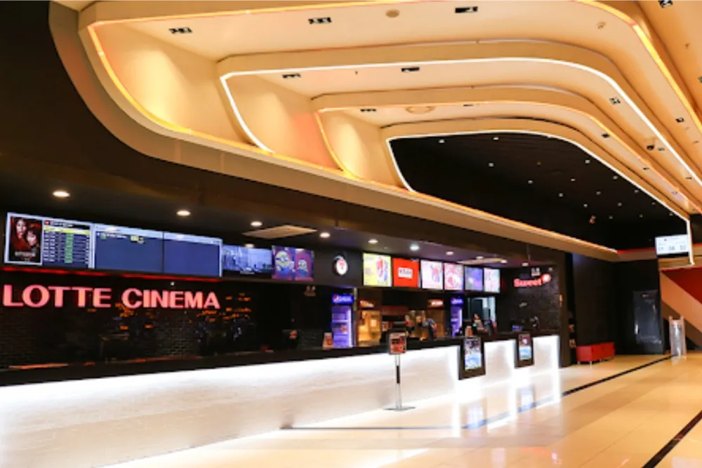 A split image showing Lotte Cinema and Megabox logos, looking like they are moving away from each other.