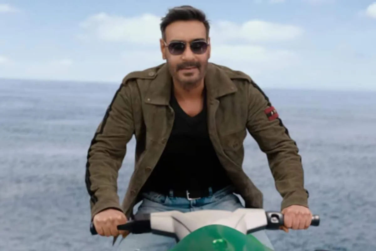 A movie poster for Dhamaal 4 featuring Ajay Devgn and other actors.