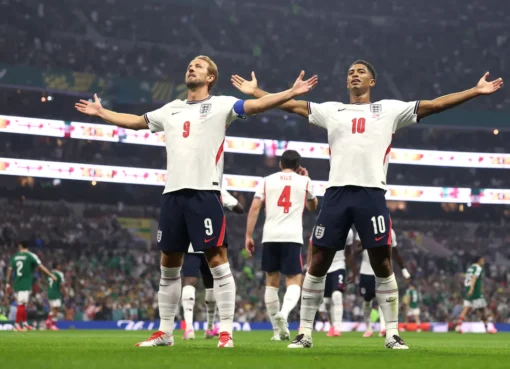 Soccer players celebrating a goal during a match.