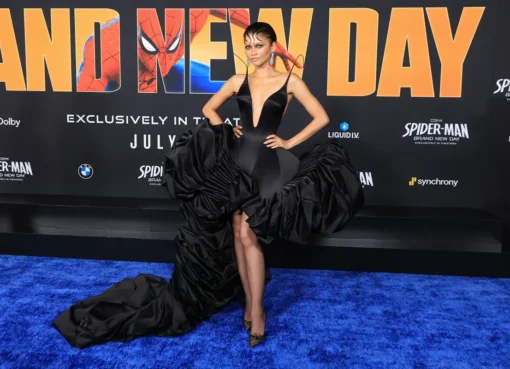 Zendaya in a black satin Ashi Studio corset with a dramatic architectural train at a movie premiere.