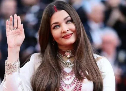 Aishwarya Rai Bachchan smiling, looking elegant in a close-up photo.