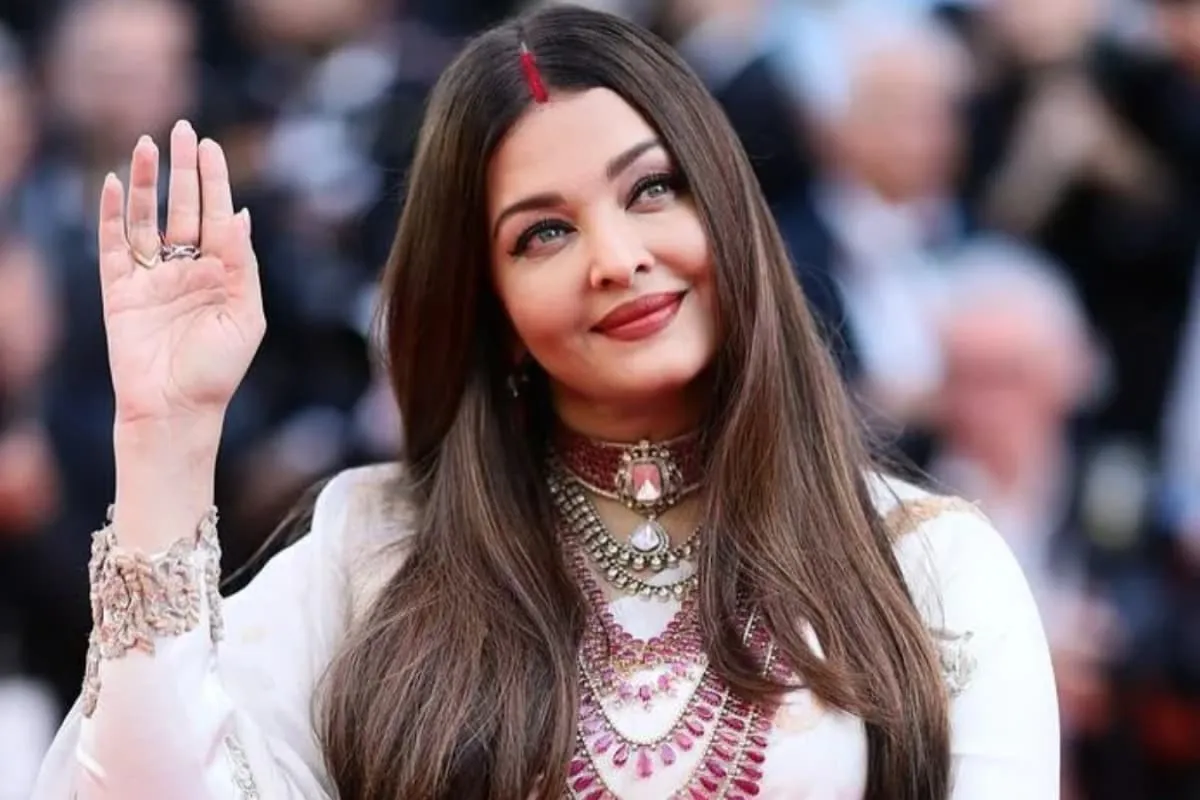 Aishwarya Rai Bachchan smiling, looking elegant in a close-up photo.