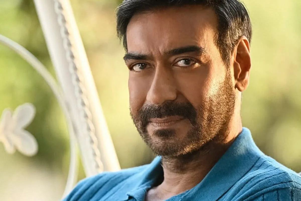 Ajay Devgn smiling in a Vimal Elaichi advertisement.