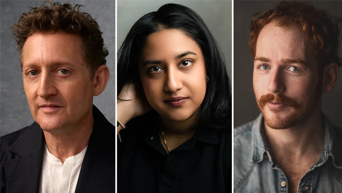 Alex Winter smiling and looking directly at the camera.