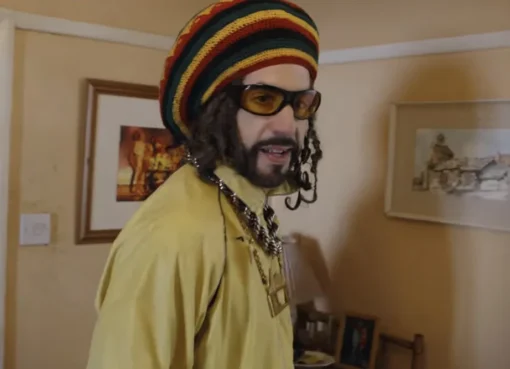 Sacha Baron Cohen as Ali G looking surprised and a bit clueless in the 'Ali G: Who Iz I?' trailer.