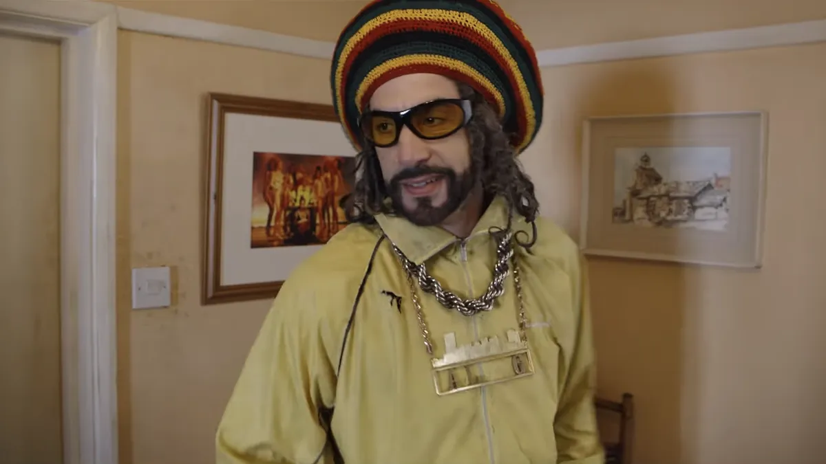 Screenshot from the Ali G movie trailer showing the character with his signature look.