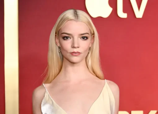 Anya Taylor-Joy looking thoughtful at an event.