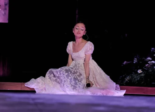 Pop star Ariana Grande smiling on stage.