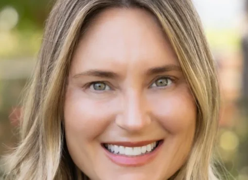 Melissa Stone smiling, a professional headshot against a bright, modern background, with a hint of Disney's creative energy.