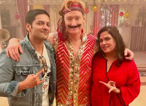 Conan O'Brien smiling with Richa Chadha and Ali Fazal, hinting at their India adventure.