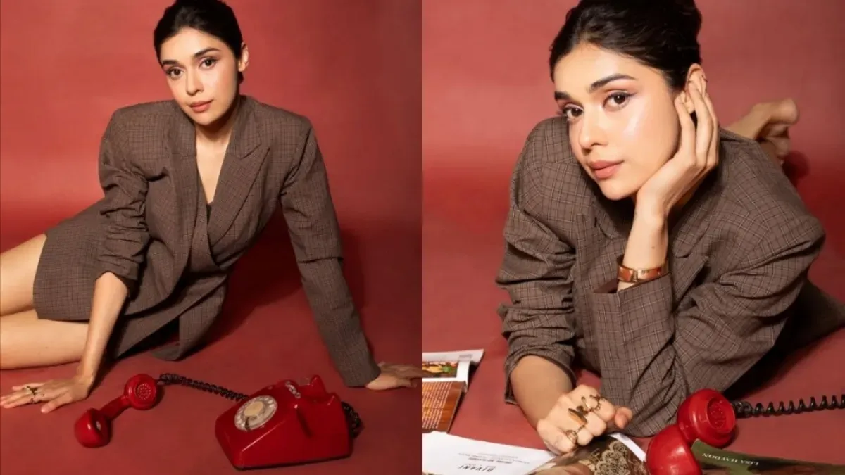 Eisha Singh in a retro outfit with bold makeup.
