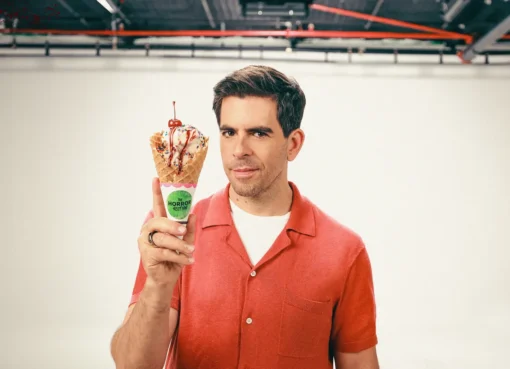 Eli Roth looking serious and determined, possibly on a film set.