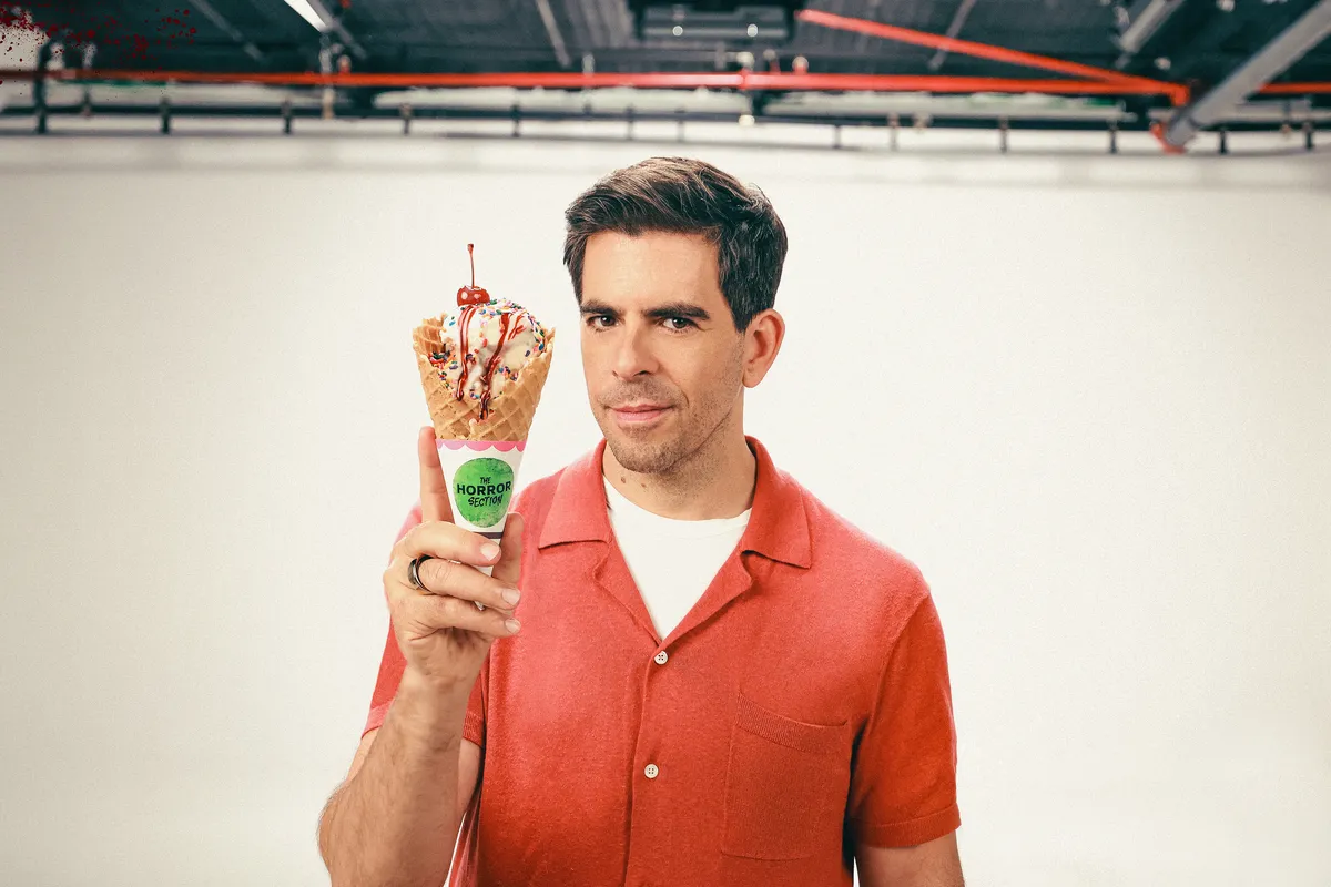 Eli Roth looking serious and determined, possibly on a film set.
