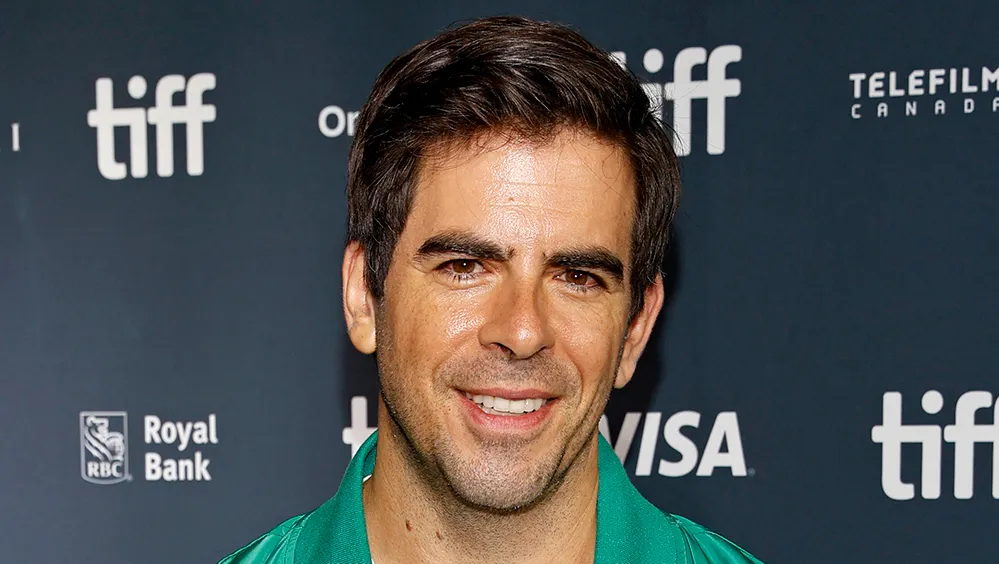 Eli Roth smiling at a film event.