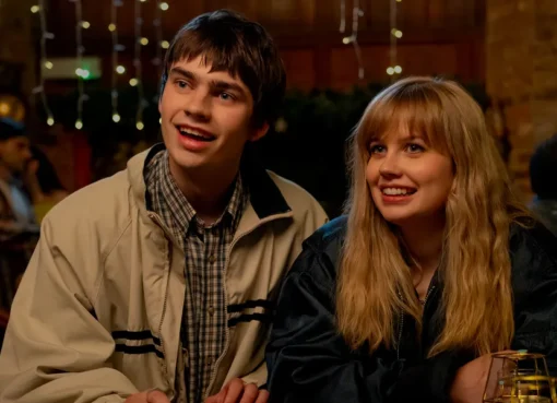 A diverse group of young adults laughing together at a vibrant, modern cafe.