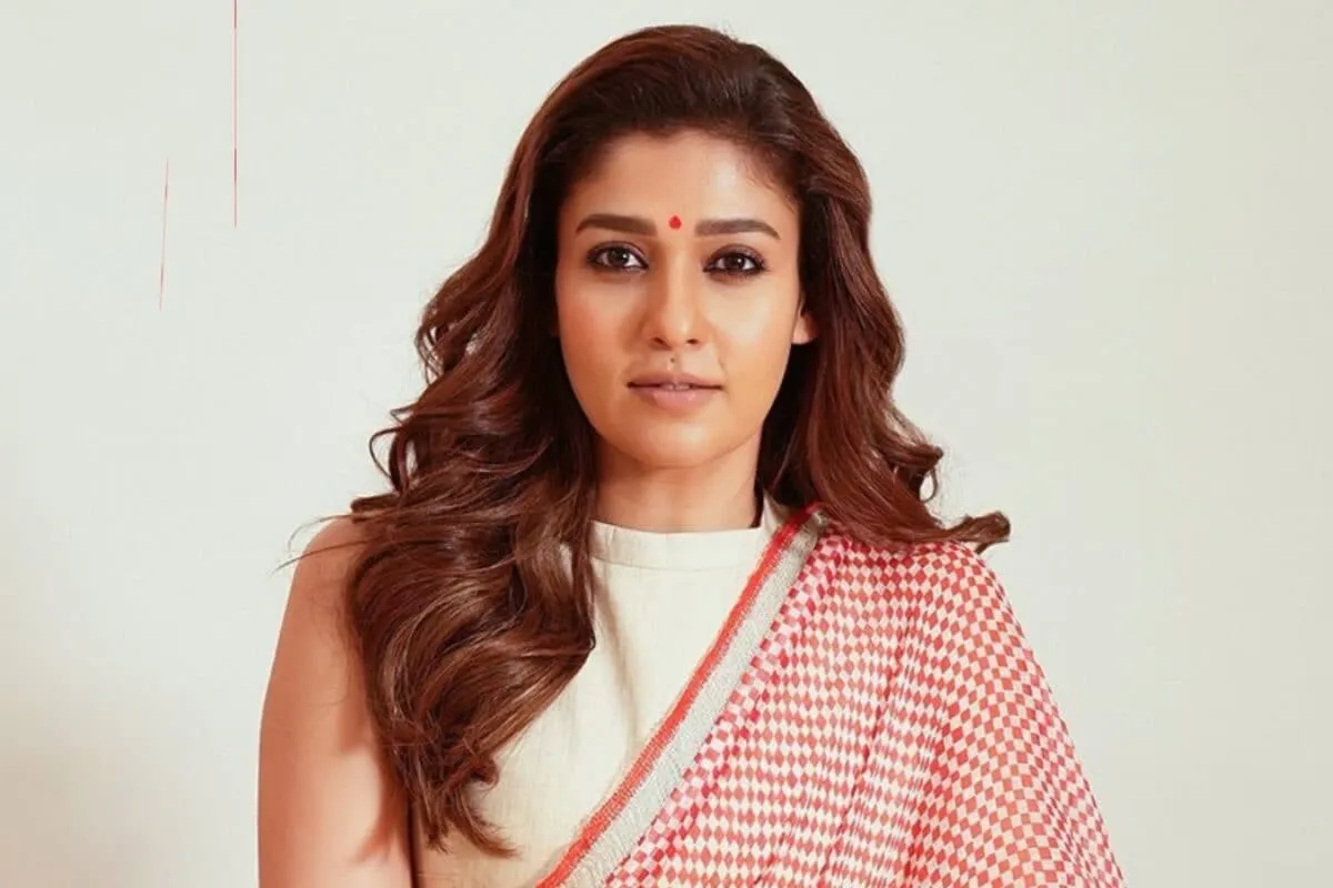 Nayanthara smiling elegantly, looking confident.