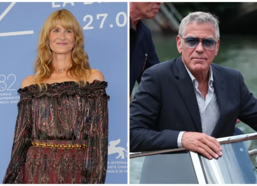 Laura Dern smiling next to George Clooney at a film festival.