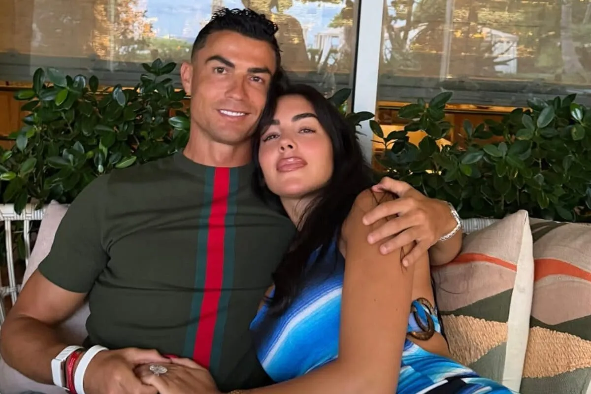 Georgina Rodriguez and Cristiano Ronaldo smiling together.