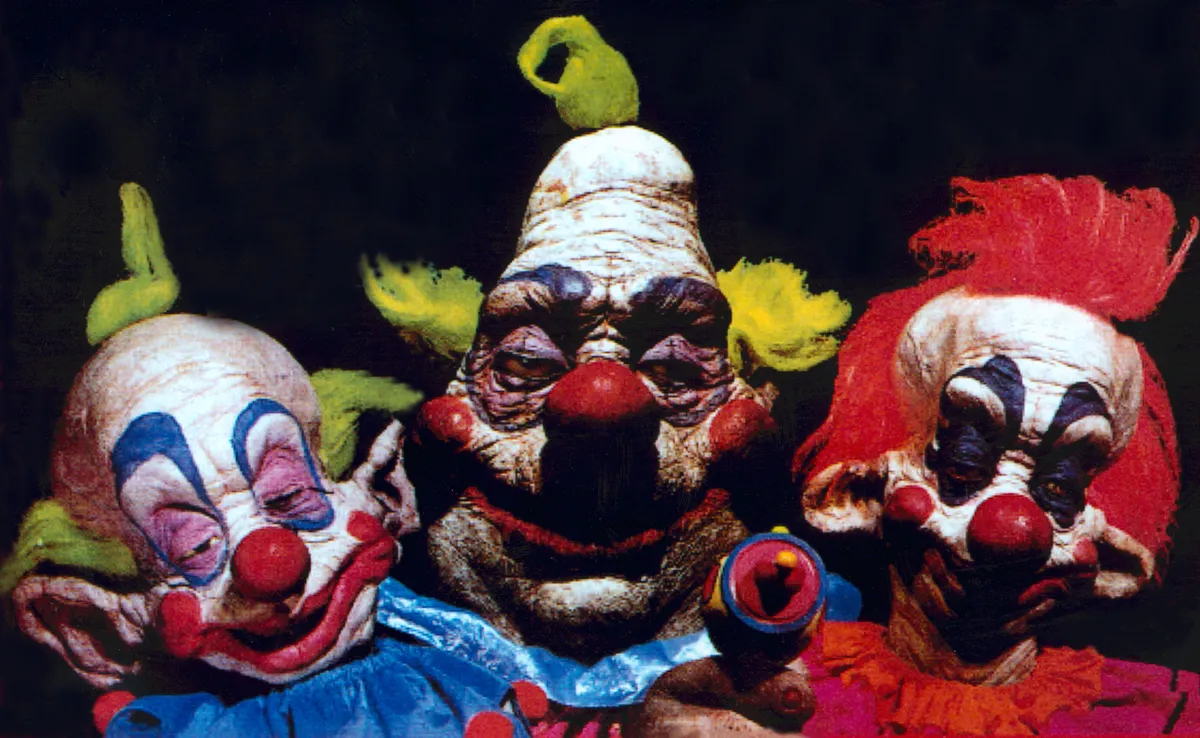 A spooky scene from a haunted house with a clown figure.