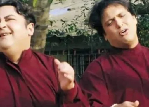 Govinda smiling on a music video set.