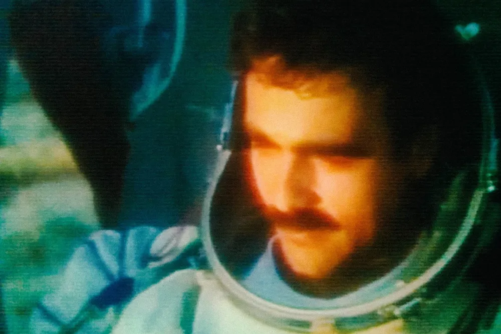 Illustration of a lone astronaut floating in space, likely a still or concept art from 'Forgotten Spaceman'.