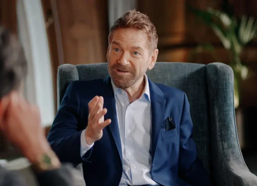 Kenneth Branagh with a determined expression, possibly in a still from an action scene, looking intense.