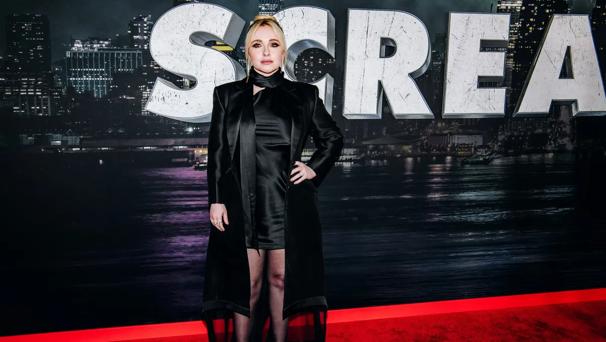 Hayden Panettiere smiling brightly at an event.