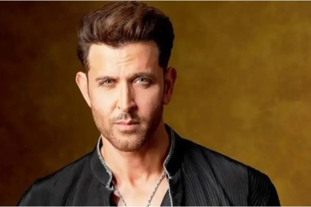 Hrithik Roshan looking thoughtful, perhaps looking at a phone screen with social media trends.
