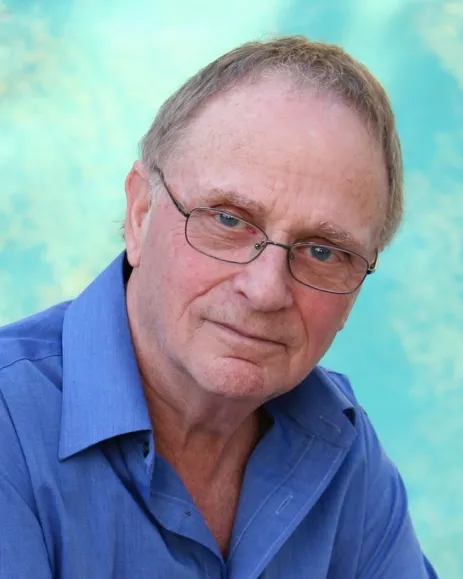 Leonard Morpurgo, a gentlemanly international film publicist, smiling slightly.