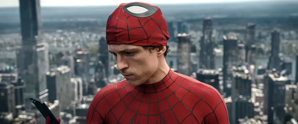 Spider-Man swinging heroically through a vibrant, stylized city at sunset.