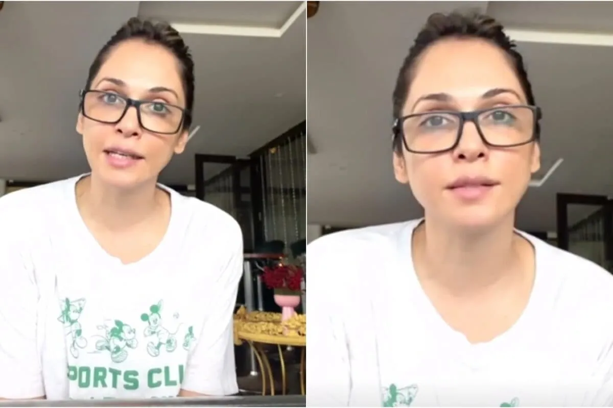 Isha Koppikar speaking passionately in a video clip with warm lighting