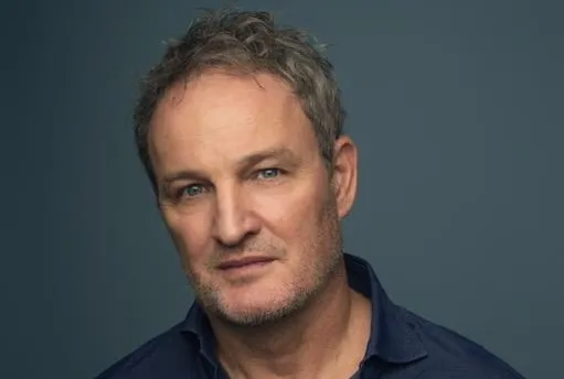 Actor Jason Clarke looking serious and ready for action.