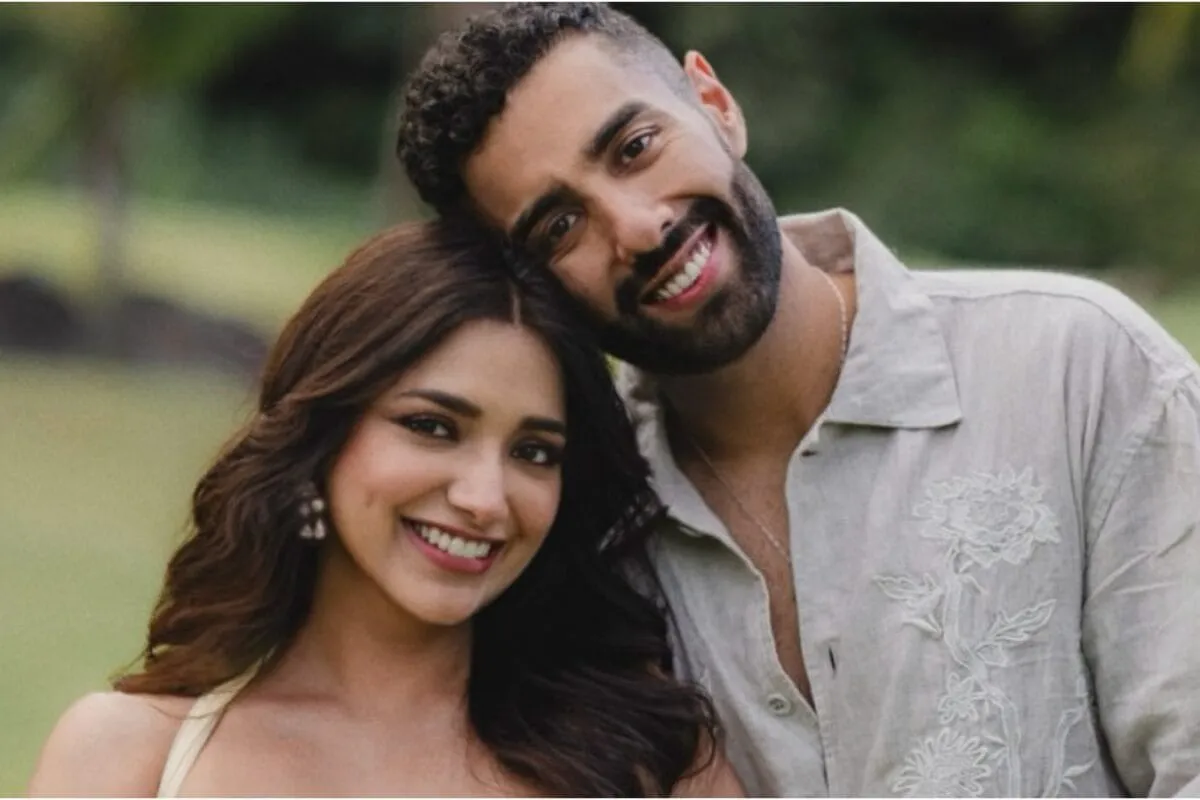 Jiyaa Shankar and Kaaran Dhanak smiling and looking happy after their engagement proposal.