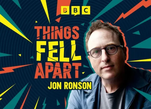 Jon Ronson smiling with a microphone, ready to tell an engaging story.