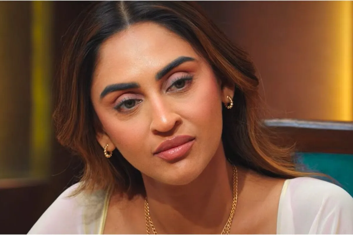 Krystle D'Souza smiling, looking confident.