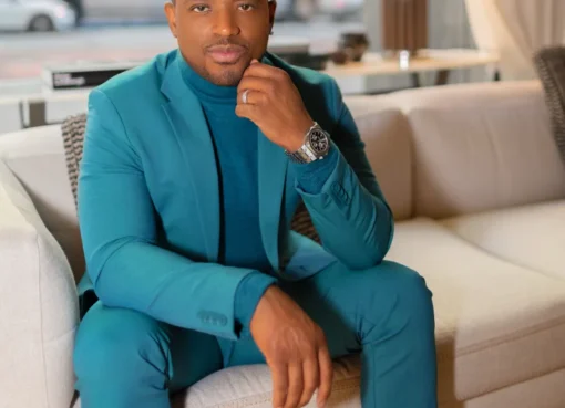 Larenz Tate smiling, looking sharp.