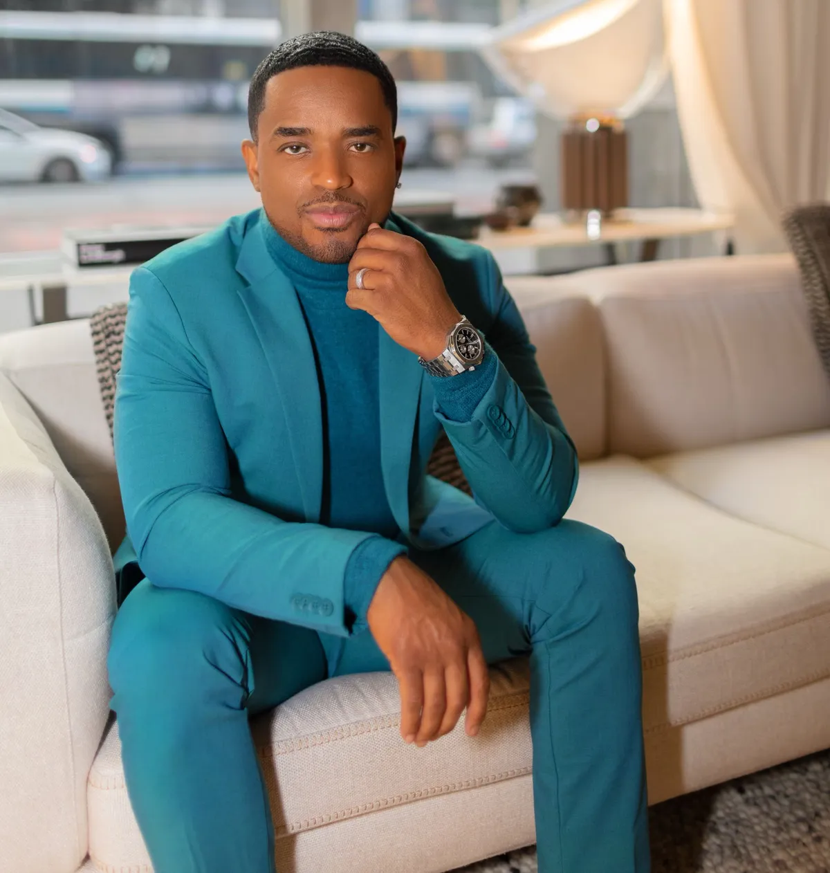 Larenz Tate smiling, looking sharp.