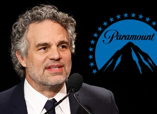 Mark Ruffalo looking serious and speaking at a microphone.