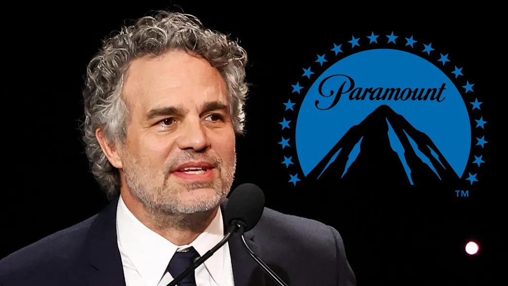 Mark Ruffalo looking serious and speaking at a microphone.