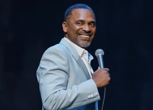 Comedian Mike Epps smiling on stage.