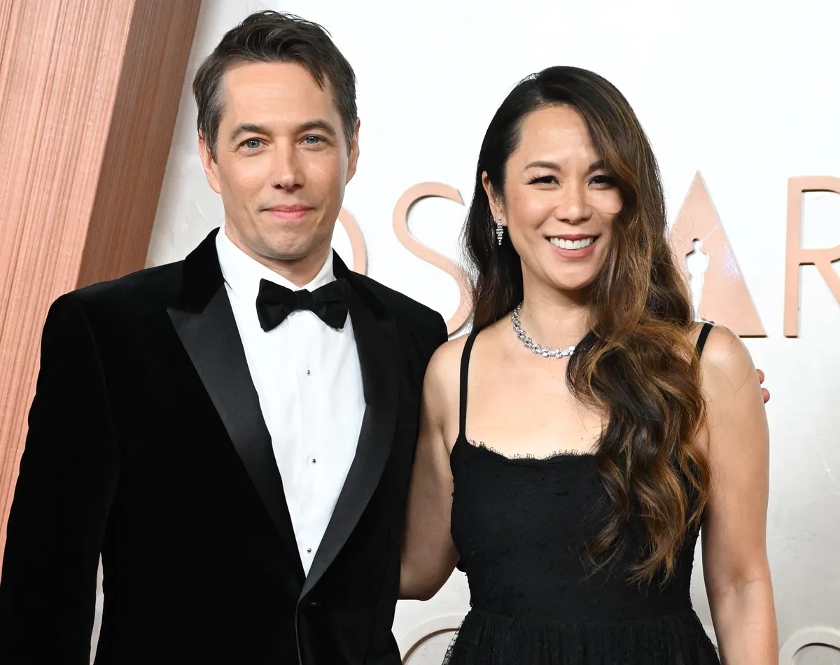 Sean Baker and Samantha Quan smiling together at an event.