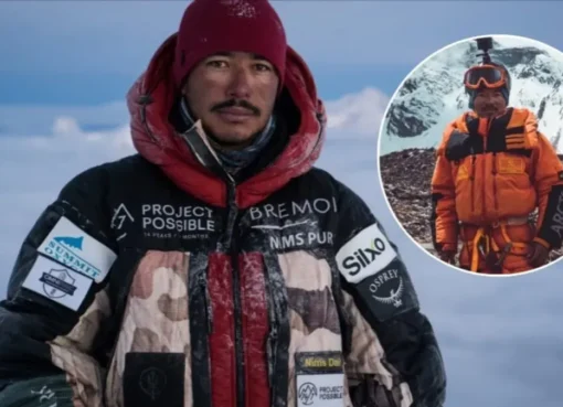 A close-up shot of Nims Purja in his mountaineering gear, with a serious but determined expression.