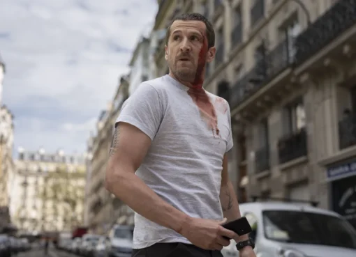 Guillaume Canet with an intense expression, looking ready for action, from the film Ad Vitam.